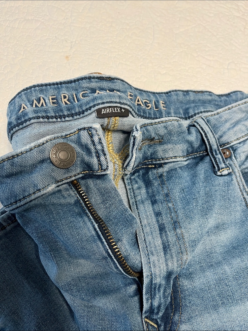 American Eagle Light Blue Denim Jeans with Brown Leather Patch